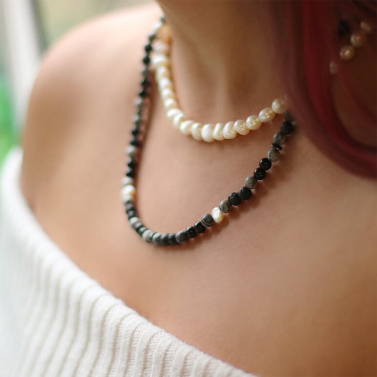 8mm white baroque freshwater pearl necklace with a sterling silver clasp paired with a 6mm lava stone black agate white baroque freshwater pearl necklace with a stainless steel clasp