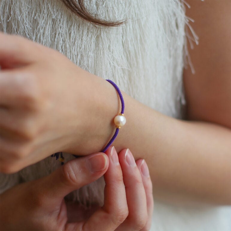 6mm freshwater pearl adjustable tassel bracelet on recycled plastic coloured thread
