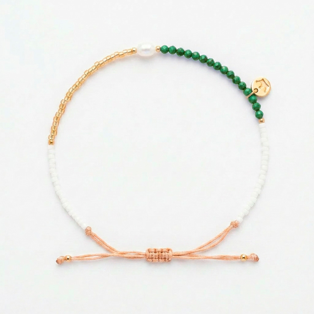 white 4mm oval freshwater pearl adjustable bracelet with semi-precious stones and white and yellow gold coloured beads
