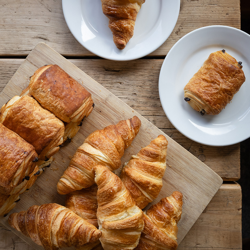Platter of fresh baked breakfast pastries at Cornwall Gold