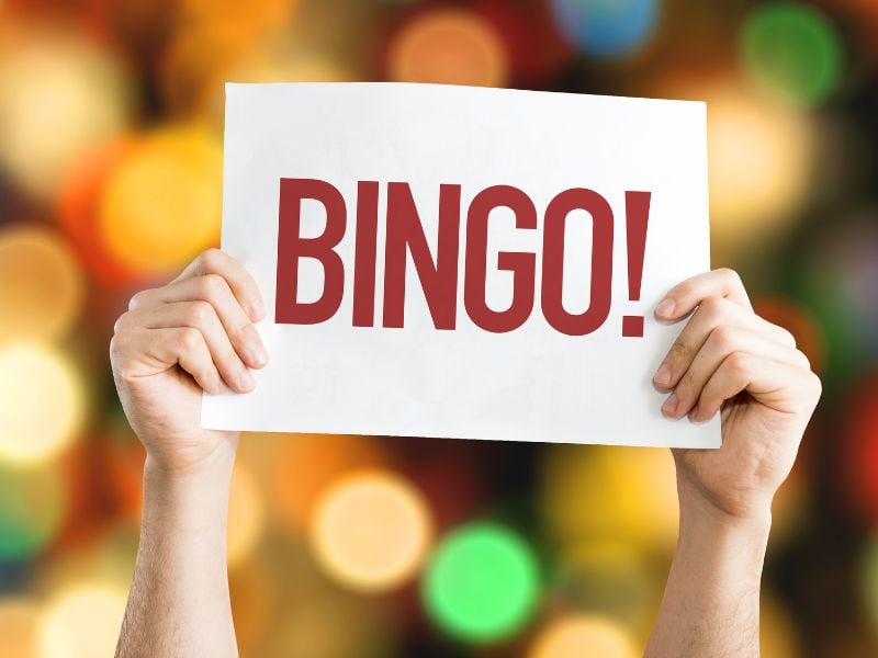 person holidng up a red BINGO sign